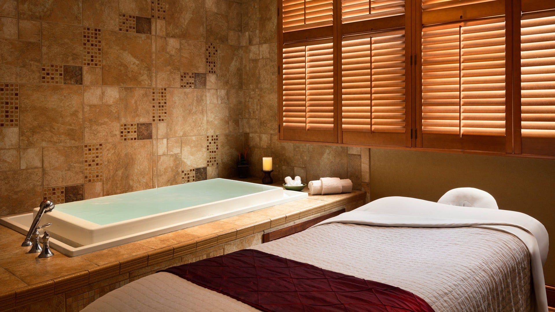massage table with dipping tub and shutters in a spa