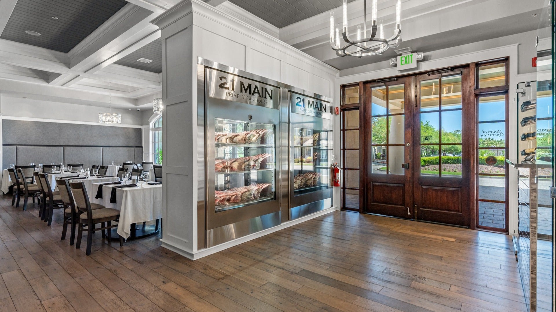 restaurant interior with steaks, dining tables and chairs