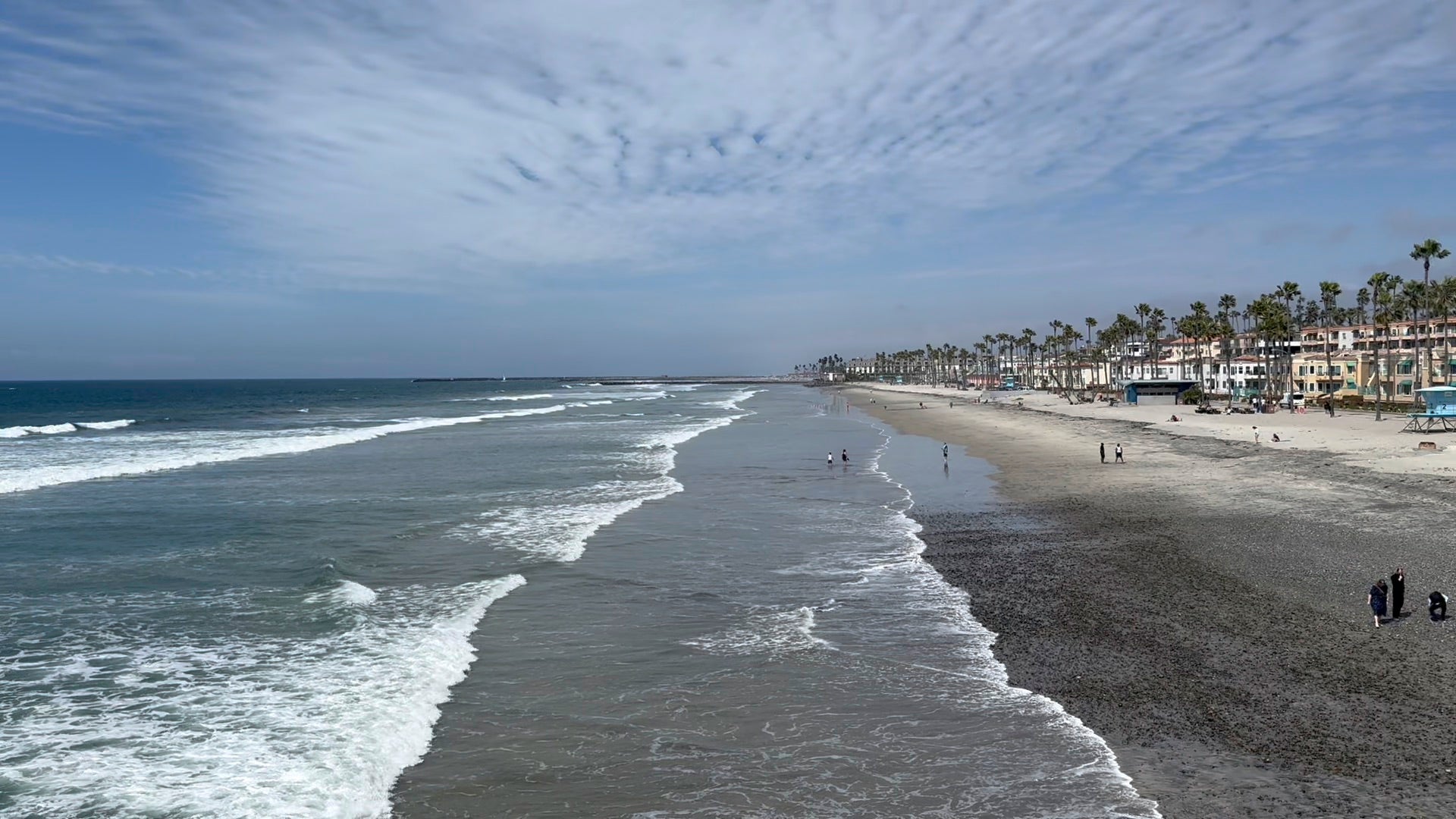 View of beach and ocean along the coast from the Oceanside pier