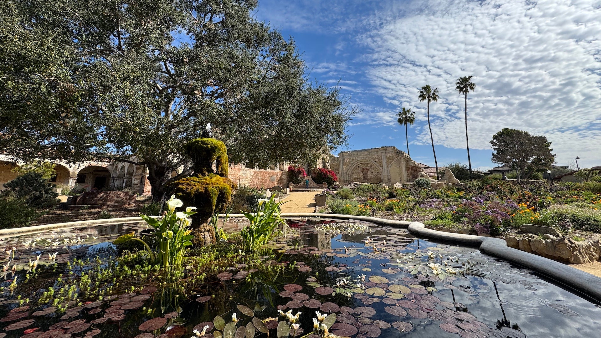 A lily pond and gardens in front of the mission at - San Juan Capistrano, California