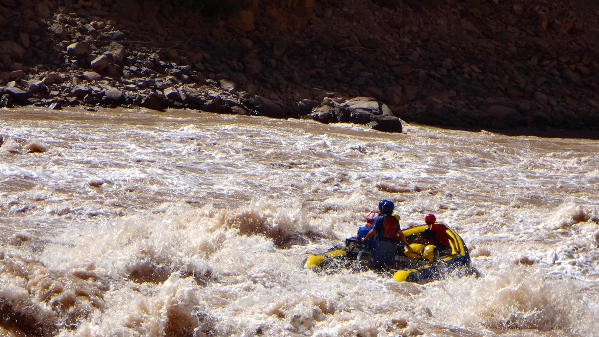 group of people going white water rafting in the colorado river