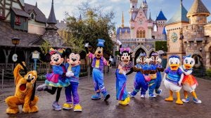 9 disney characters dressed in 70th birthday celebration attire at disneyland