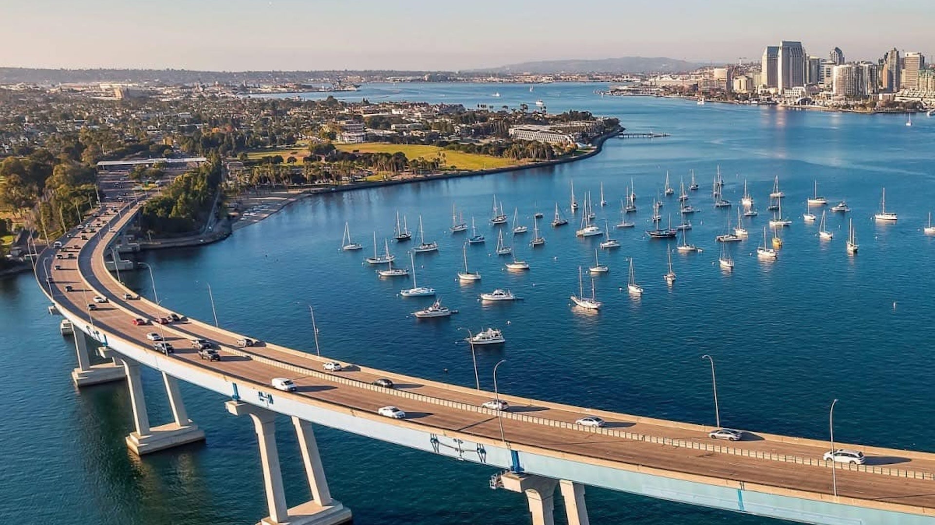 aerial view of a bridge with a lot of boats