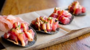 tapas on chips served on a platter