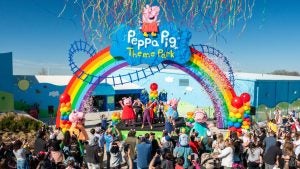 opening of a theme park with people celebrating on stage