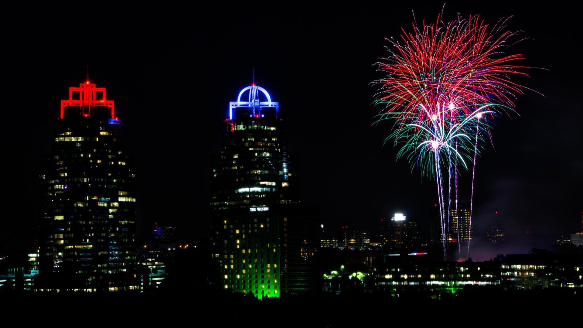 fireworks and light shows atop buildings