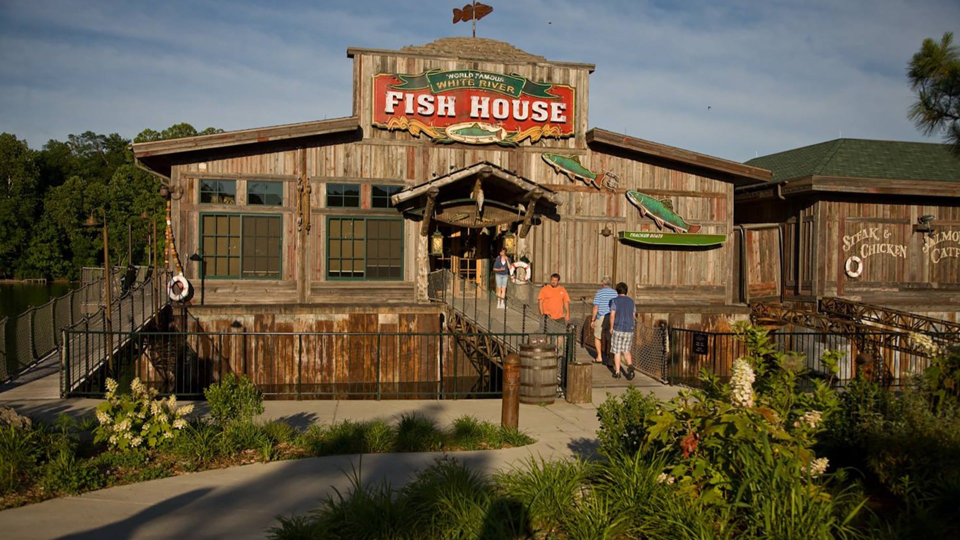 restaurant exterior with people coming in and out of it