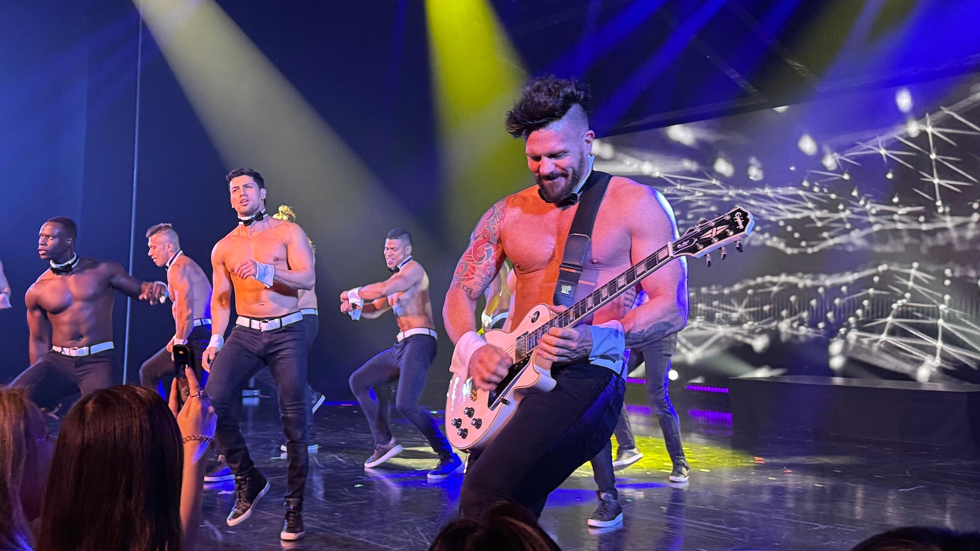 male dancers performing on stage