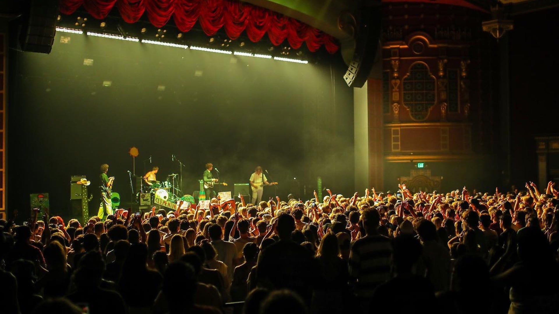 view of a concert crowd with a band on stage
