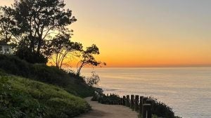 sunset view of the beach from the mountain