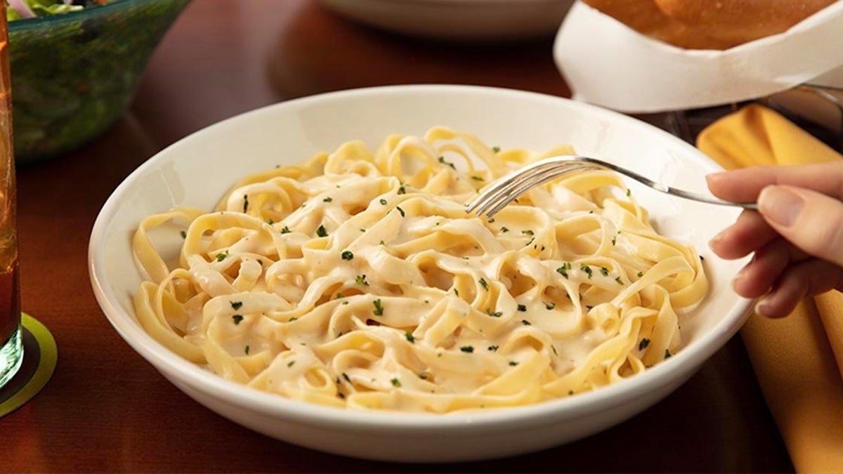 Bowl of fettuccini alfredo pasta on a table