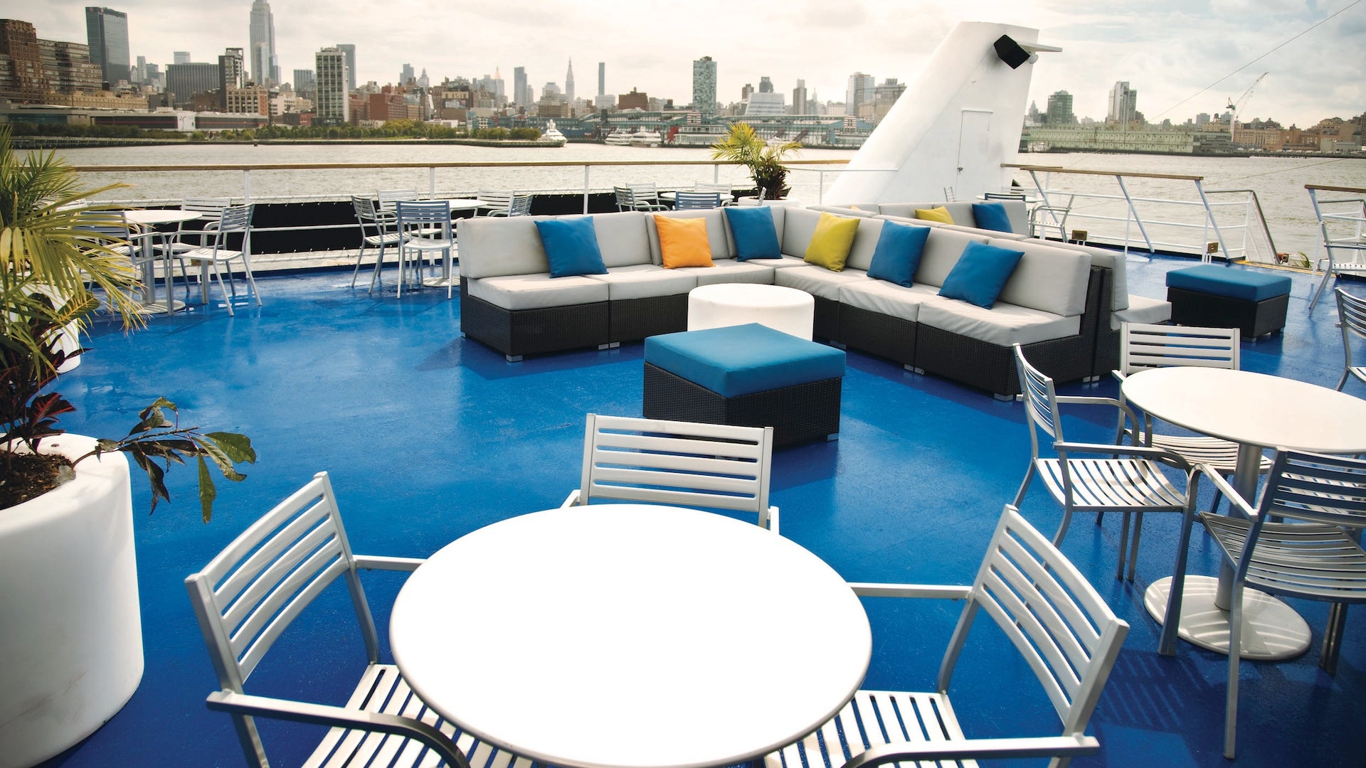 chairs, tables, and sofas in a boat