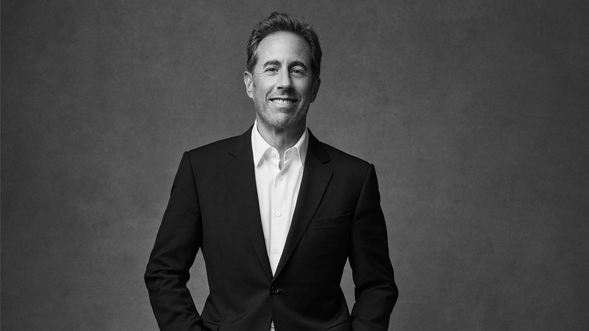 man posing in a portrait in black and white