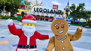 Santa and gingerbread lego figures in front of the entrance to Legoland Florida in Orlando Florida