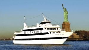 a boat sailing near the Statue of Liberty
