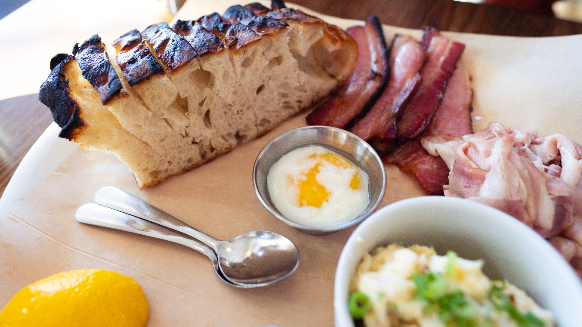 bread, bacon, egg on food plate