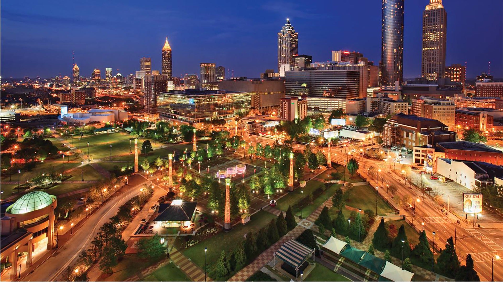 park at night with city skyline view