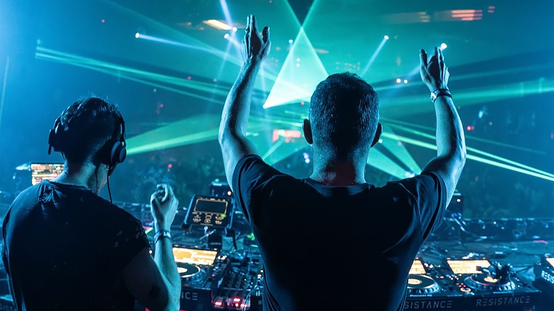 club djs with a crowd dancing