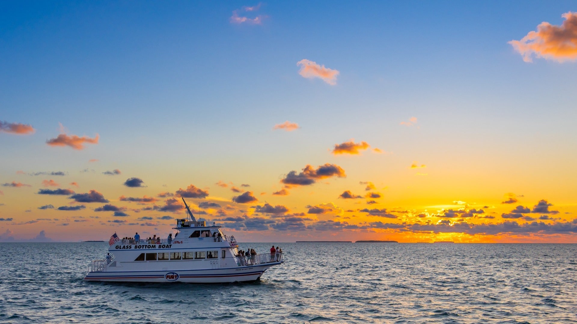 people on a sunset boat tour