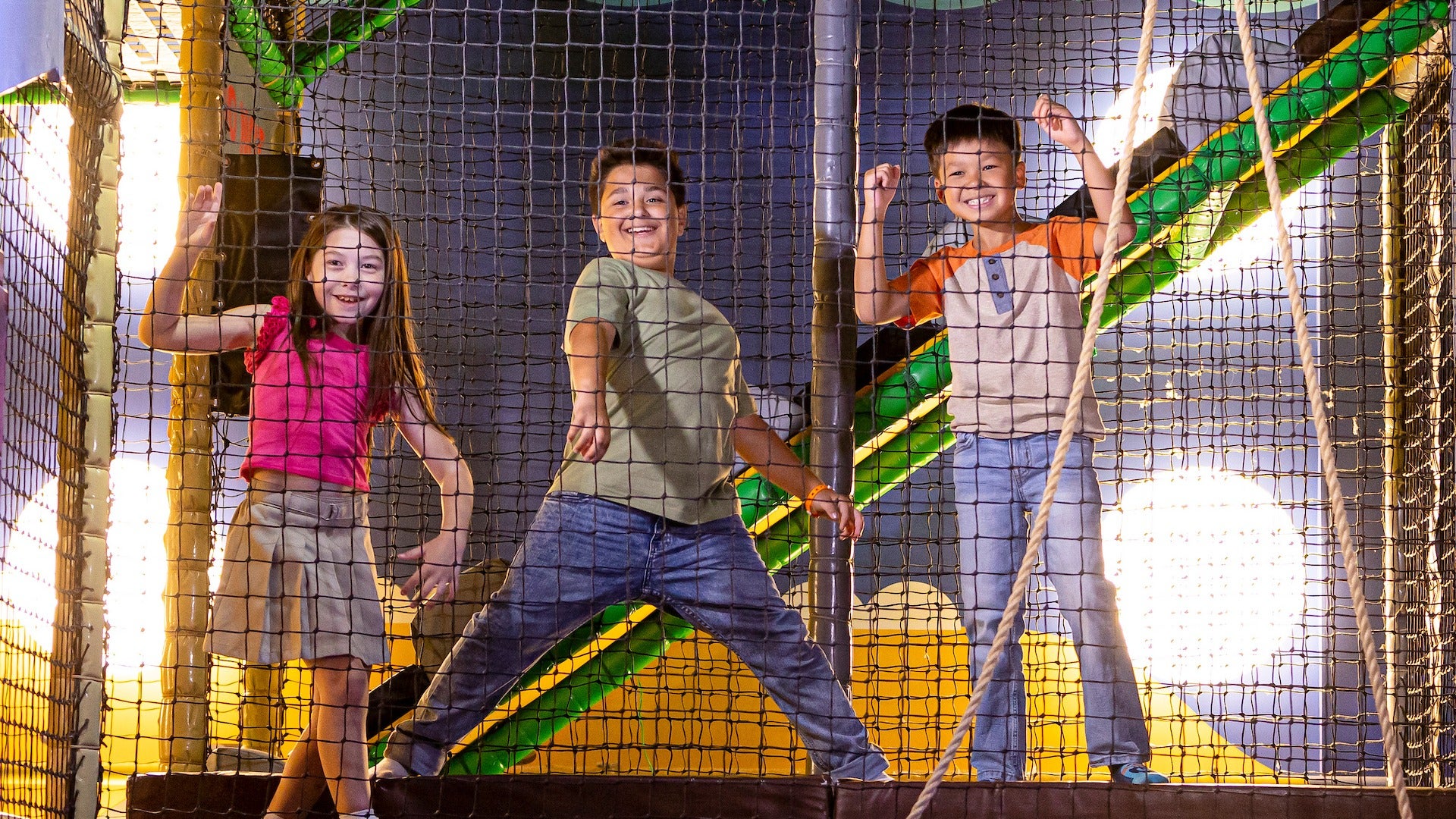 kids playing in a netted structure