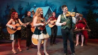 group of performers on stage