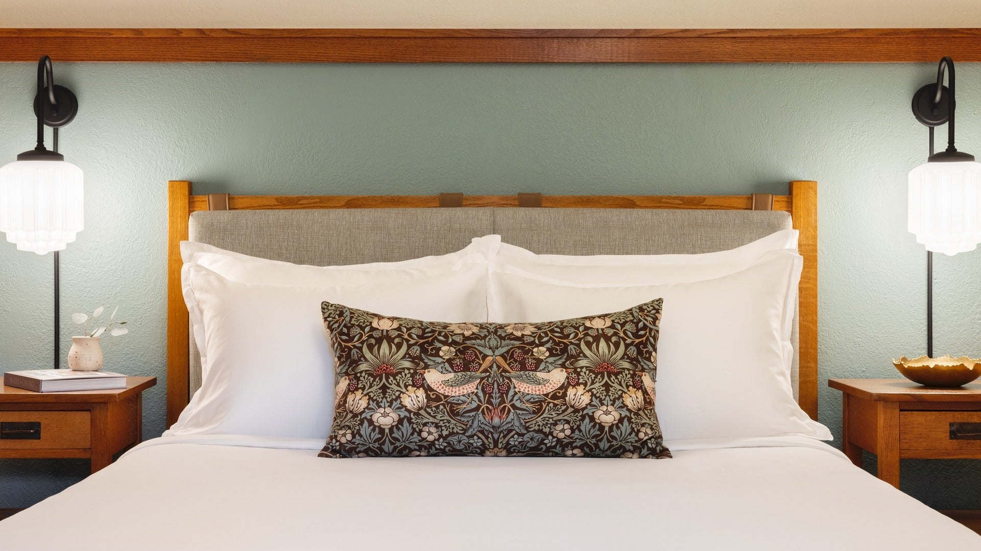 hotel bed with lamps on either side
