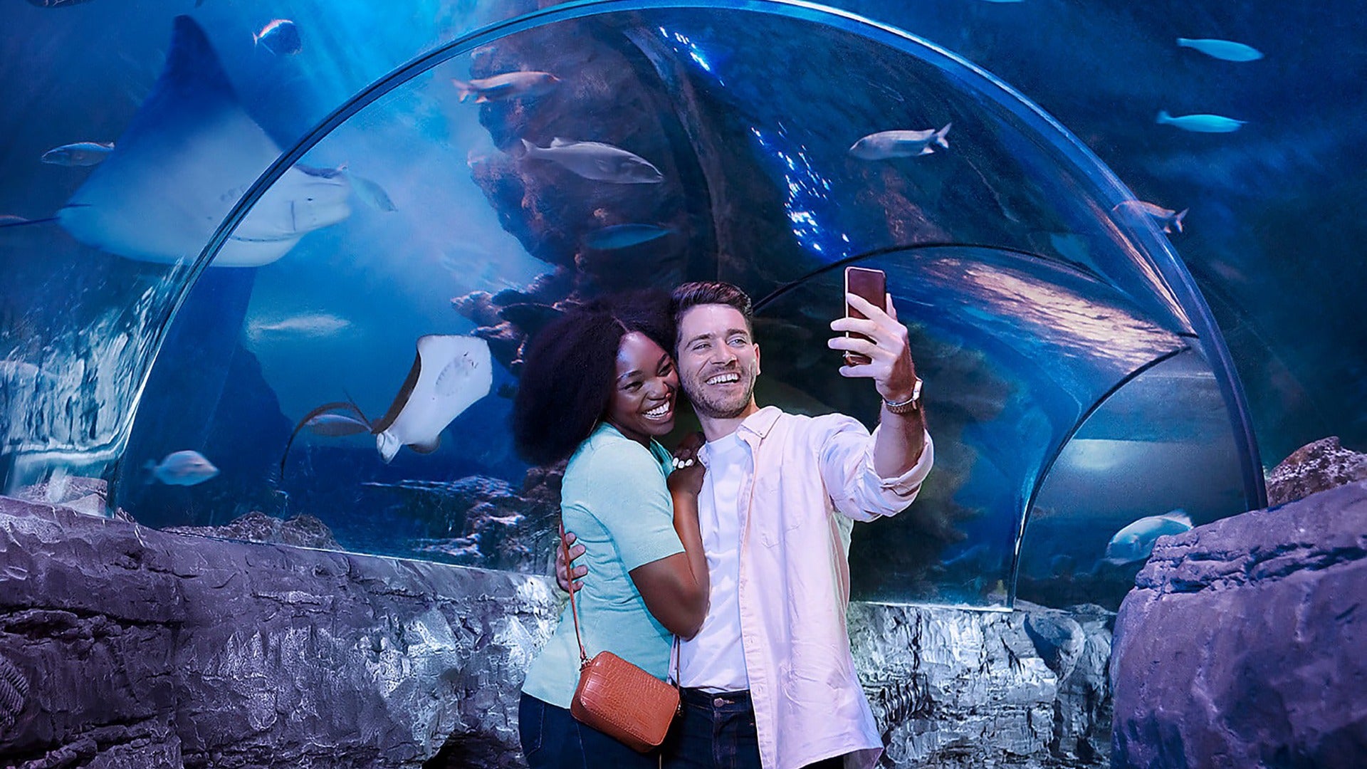 couple taking a selfie in an aquarium