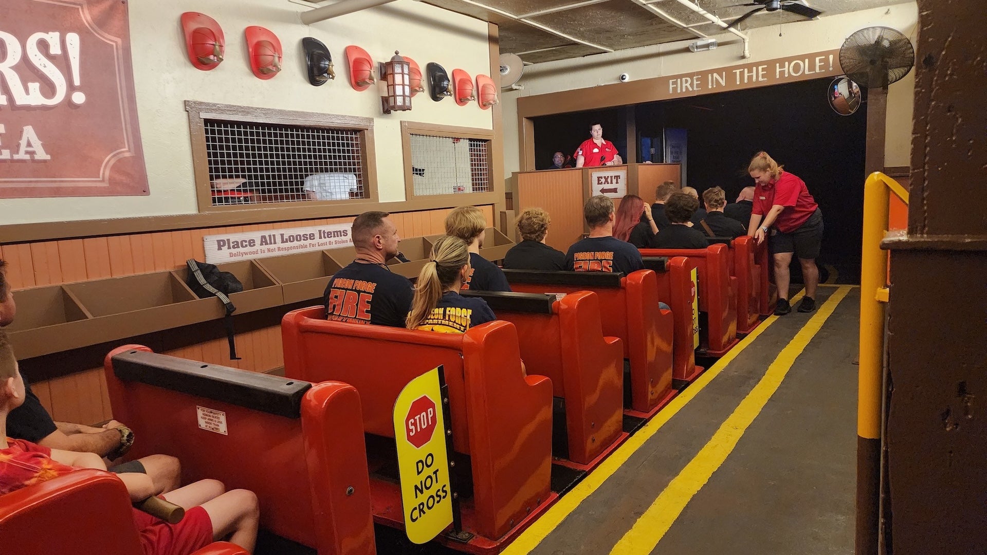 people riding in red seats