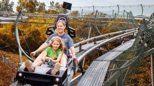 woman and child on a mountain coaster