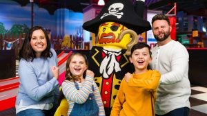 family with a lego character mascot