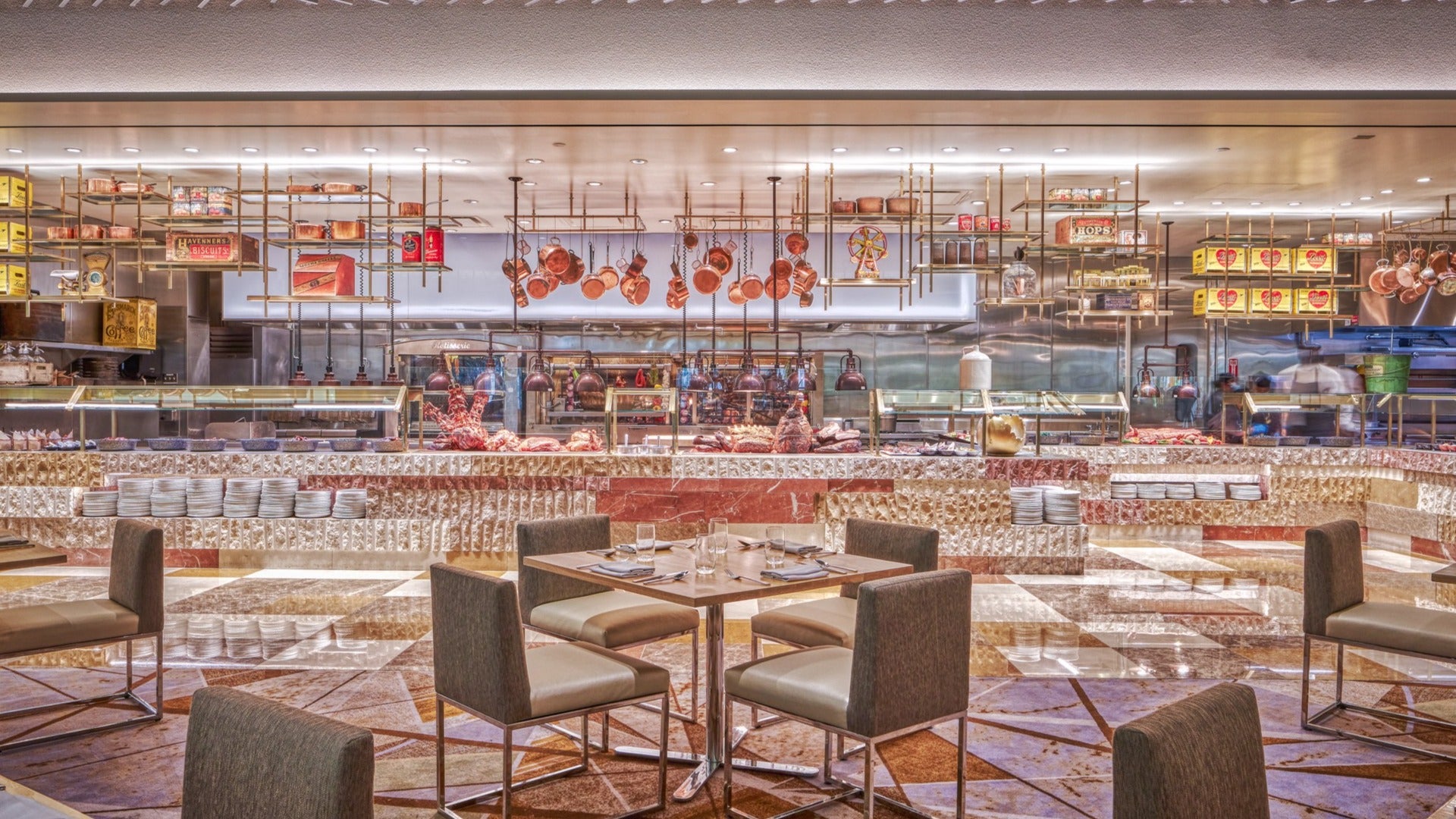 restaurant interior with dining tables and chairs and a chef's station