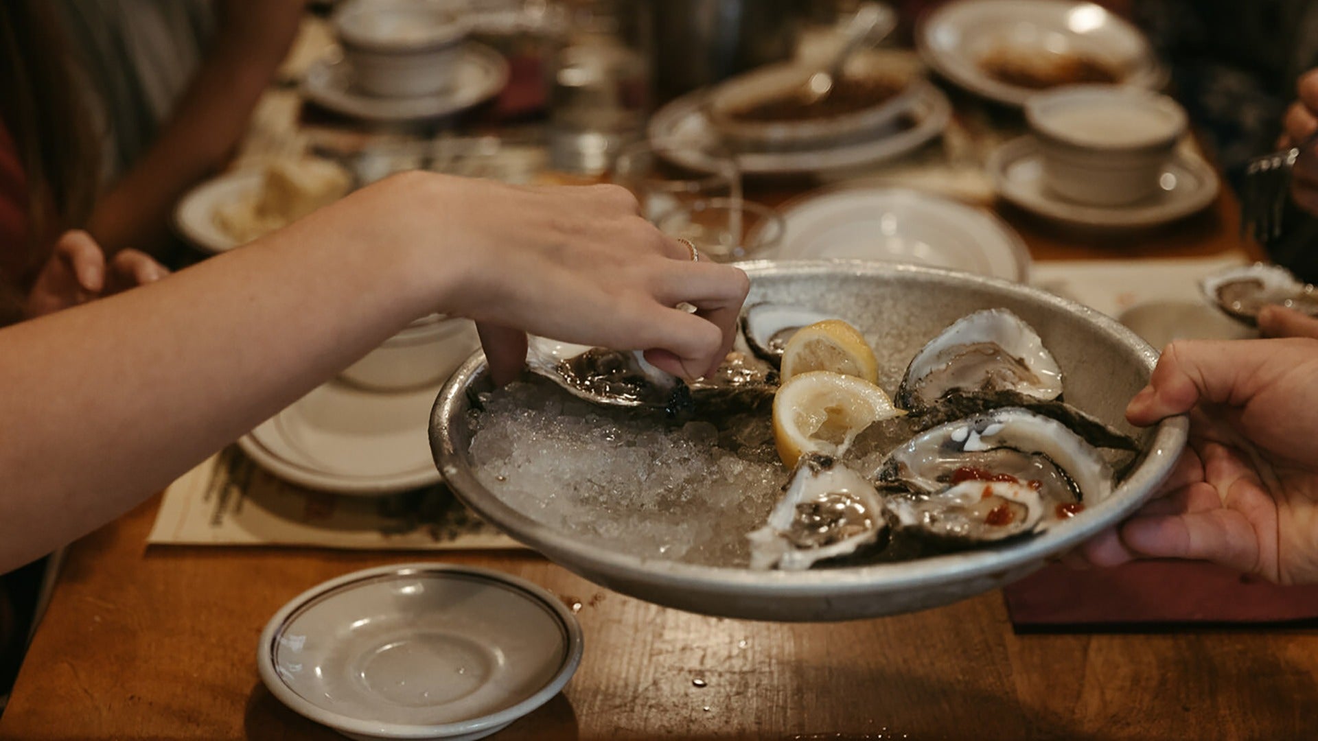 people eating oysters