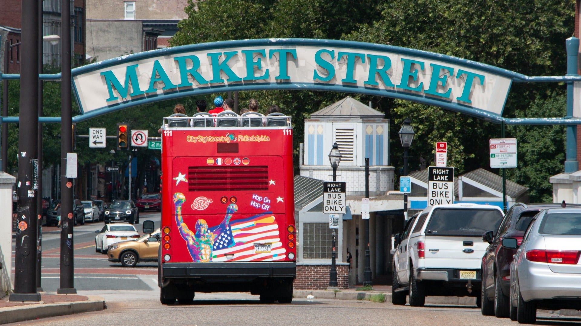 sightseeing bus tour passing by market street
