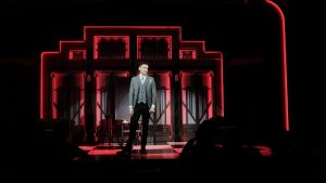 a man standing in front of the stage