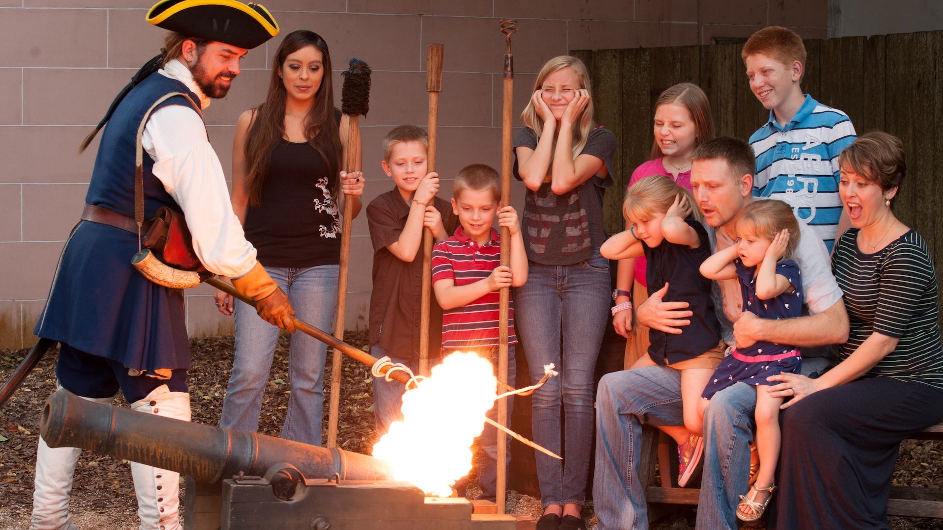 a big family watching a torch burning