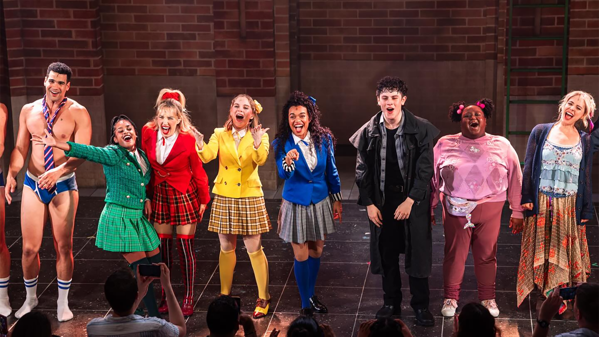 cast of a musical on stage