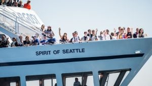 people abord a cruise waving