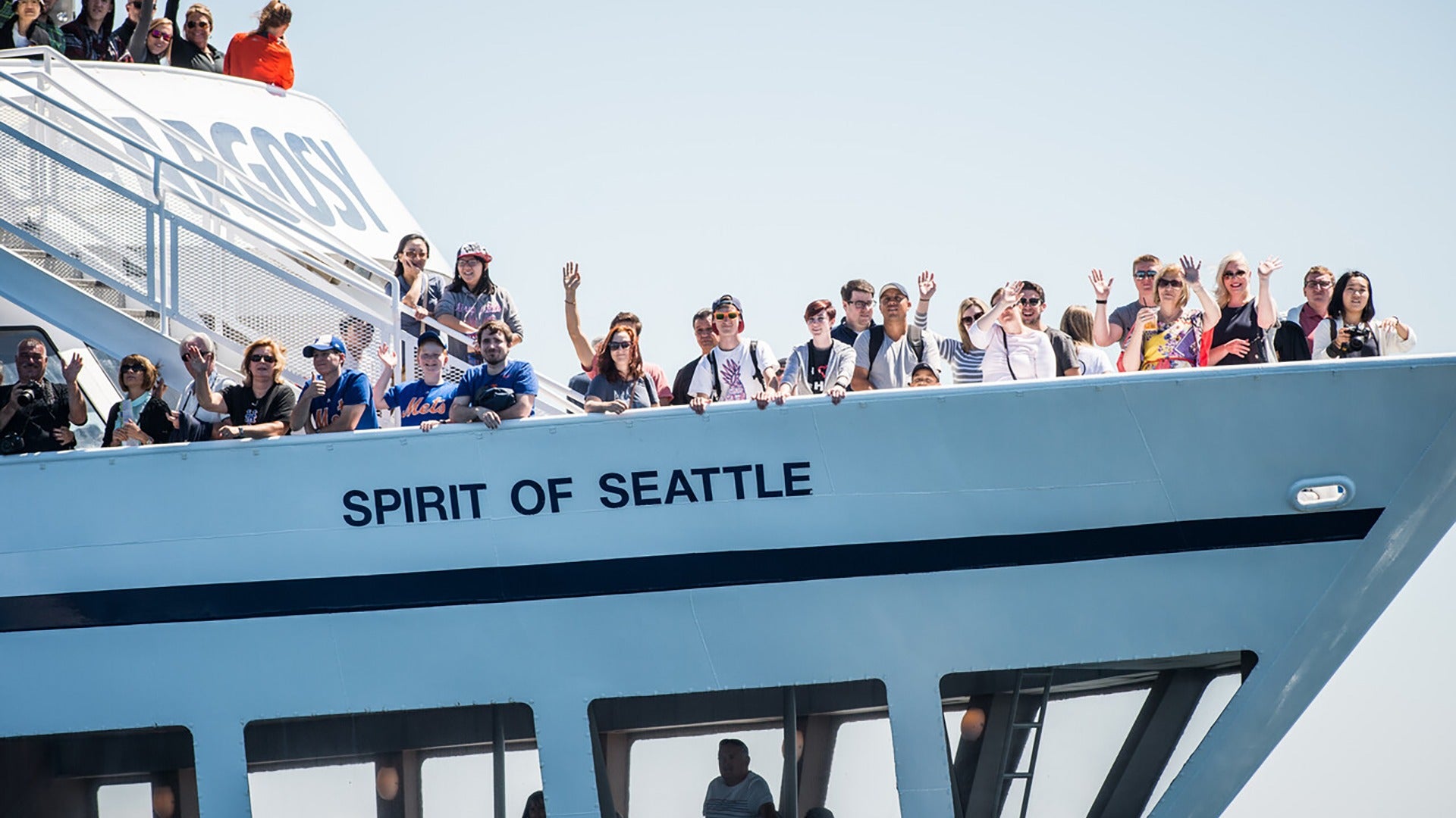 people abord a cruise waving