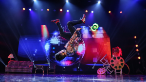 man performing acrobatic tricks on stage