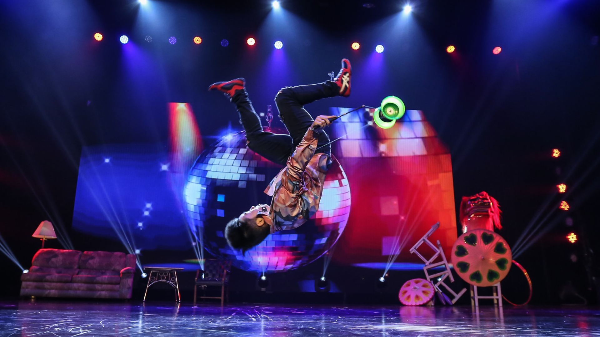 man performing acrobatic tricks on stage