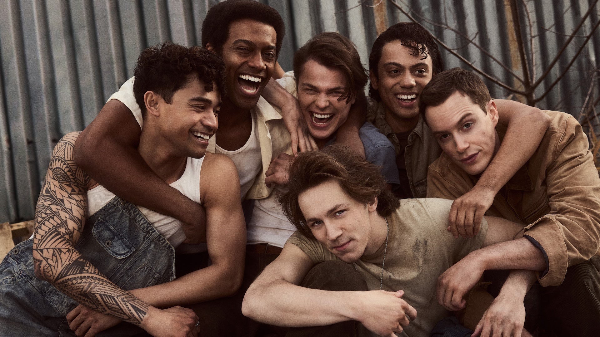 six people hugging each other