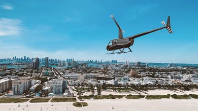 a helicopter flying above a city