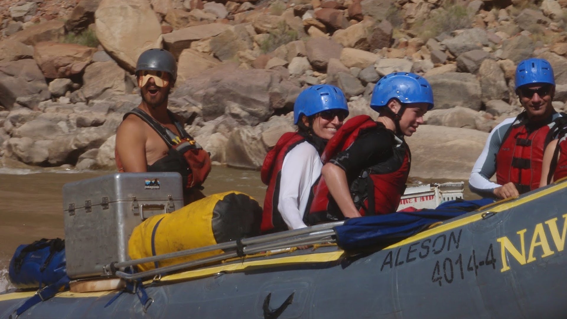 people in a speed boat