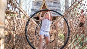a child playing on rope courses