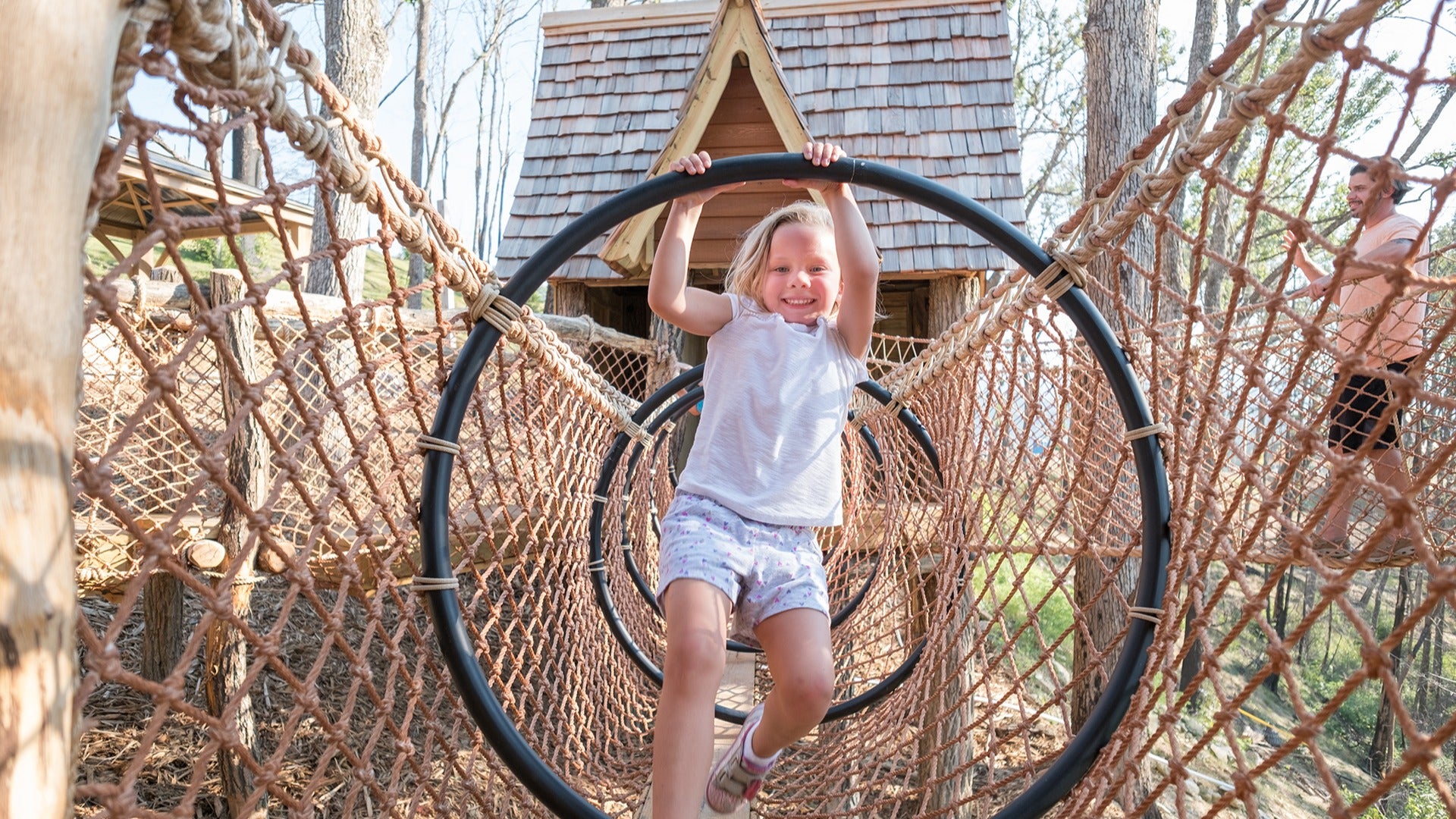 a child playing on rope courses