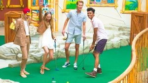 group of friends playing mini golf