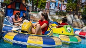 people on a water ride splashing each other