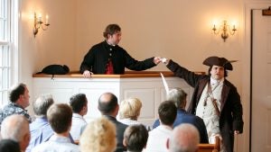 two men in costume with an audience