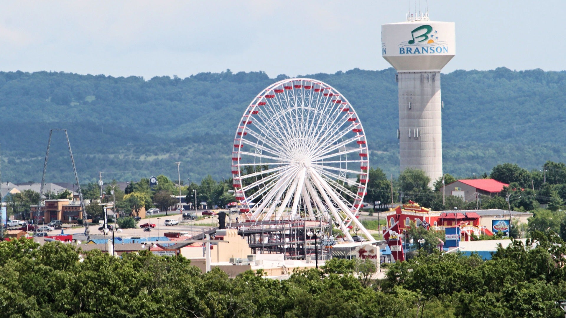 ferris wheel with view of mountains at the back