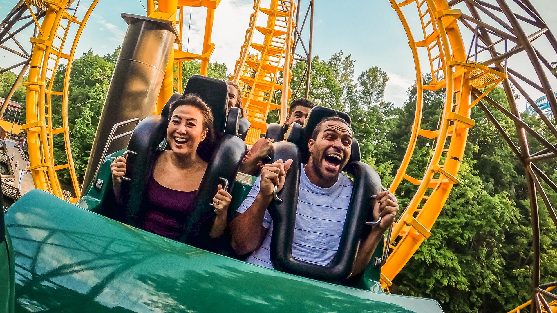 people riding a roller coaster